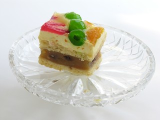 multicolour fruit cake on cristal plate