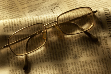 glasses on newspaper