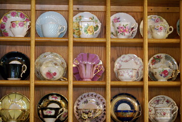 Shelves of fine china cups and saucers © geewhiz