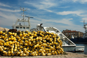Fishing net and trawler in the harbor © philipus