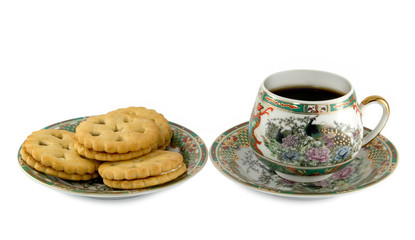 The cup coffee and cookie.