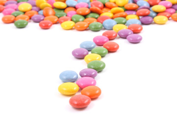 row of colorful candies isolated on white