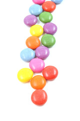row of colorful candies isolated on white
