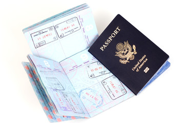 US passports with stamps for London, Rome, Frankfurt.