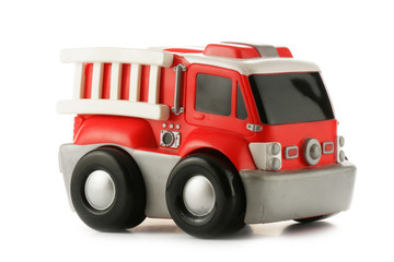 Red fire engine toy isolated over a white background