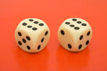 Two dices on red background