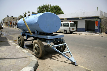 mobile water tank parked in a street in dahab, sinai, egypt