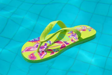 Selbstklebende Fototapeten Flip-flop inside a pool © dethchimo