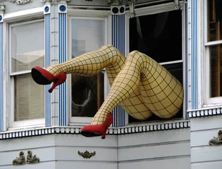Wandcirkels plexiglas Dummy legs at window, San Francisco, California © Cristian Ciobanu