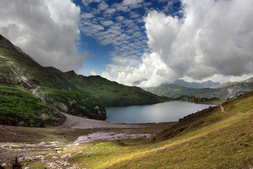 Lake in the Alps and amazing sky