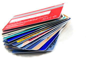Stack of colorful credit cards with small reflection
