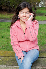 Asian girl talking on a phone