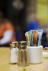 salt, pepper shakers and sugar packets