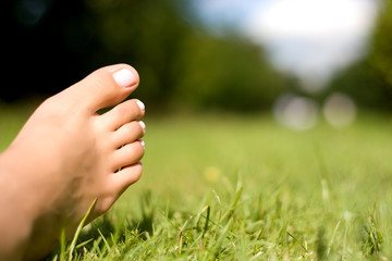 Feet and grass.