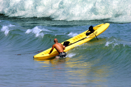 Man kayaking on vacation in California