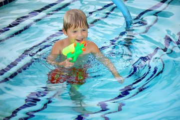 Child Squirting Water Gun