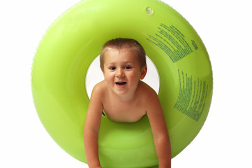 Young boy with green buoy