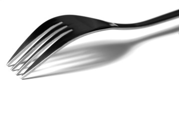 B&W image of a single fork casting a shadow