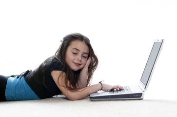  Young girl  working on the laptop and falling asleep