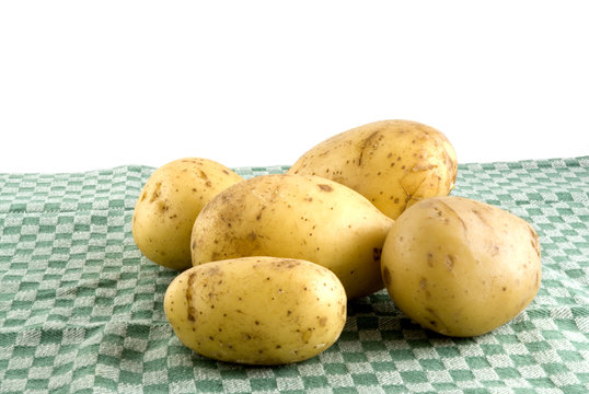 Potatoes on a green tea-cloth