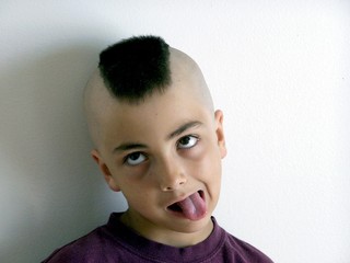 Funny face boy with mohawk haircut 