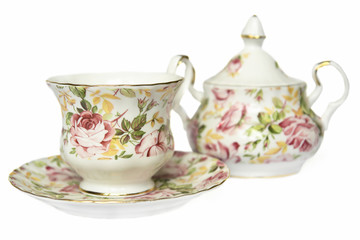 teacup on saucer and sugar bowl decorated with flowers