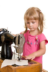 child sewing