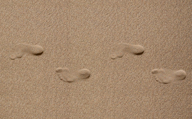 Fototapeta na wymiar Chodzenie w piasku