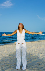 Fototapeta na wymiar Young woman Relaxation exercise on beach
