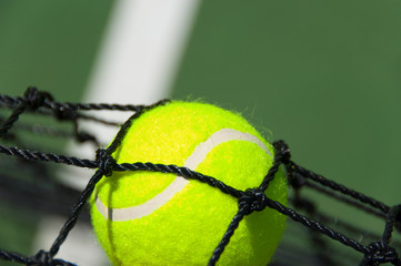 Tennis balls in net