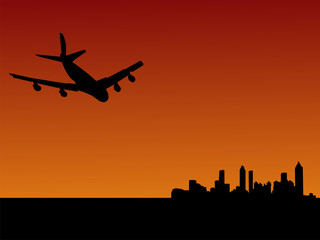 plane flying to Atlanta at dusk