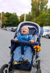 Smiling baby in sitting stroller #12
