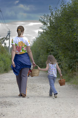 Mother and daughter are walking away