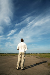 person costing on asphalt road