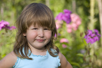 Portrait of little smiling girl outdoors