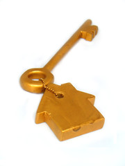 Golden key and house
