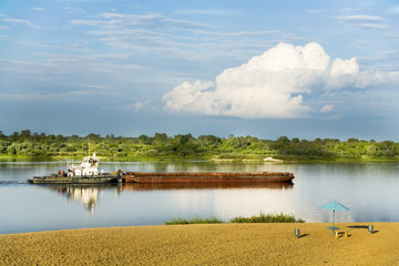 tugboat with barge on the river