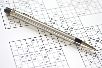 Pen on a sudoku grid.