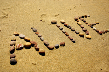 Alive stone word in the sand