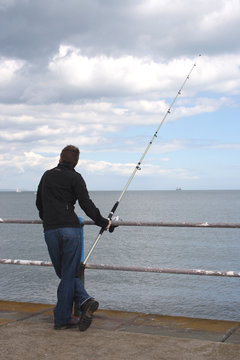 Fishing by the harbour
