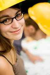 young female smiling architect,builder on a construction site