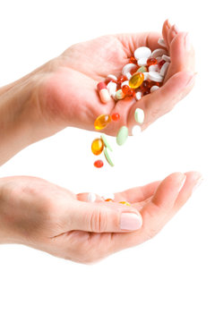  Hand pouring down bunch of pills