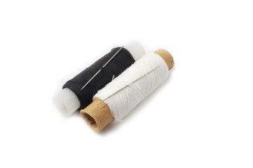 Black and white spools of thread