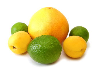 yellow lemons and green limes on white background