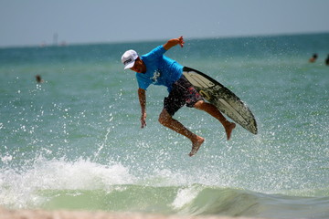 surfer falling from his board