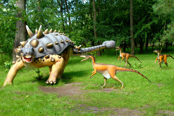 Dinosaur Troodon attacking Euoplocephalus in jurassic park, dinosaurs series