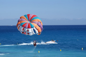 a motorboat with parachute prepared for parasailing