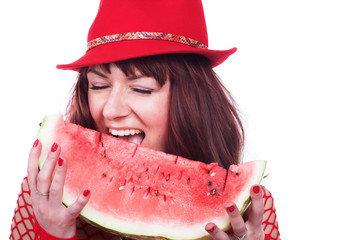The beautiful girl eats a water-melon