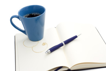 Coffee mug on notebook
