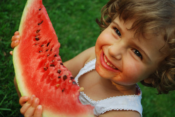 beautiful four years old craving watermelon